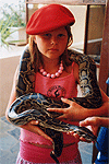 Mella can handle the boa on her own...